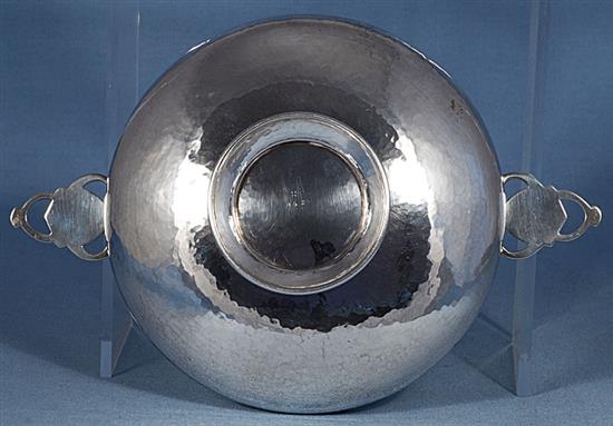 A George V Arts & Crafts silver bowl, by Albert Edward Jones, Diameter to handles 281mm, weight 9.8oz/305grms